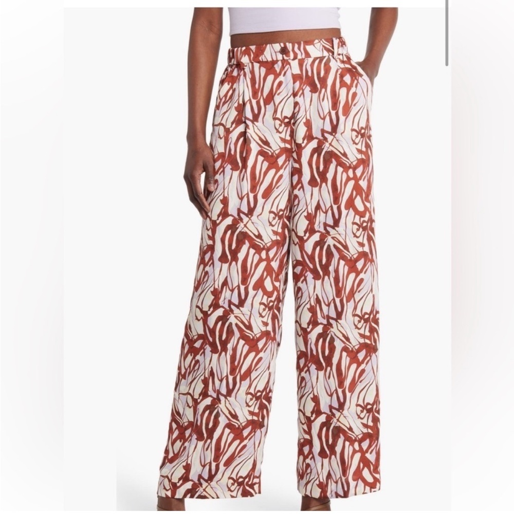 Open edit flowy pants with butterfly like patter